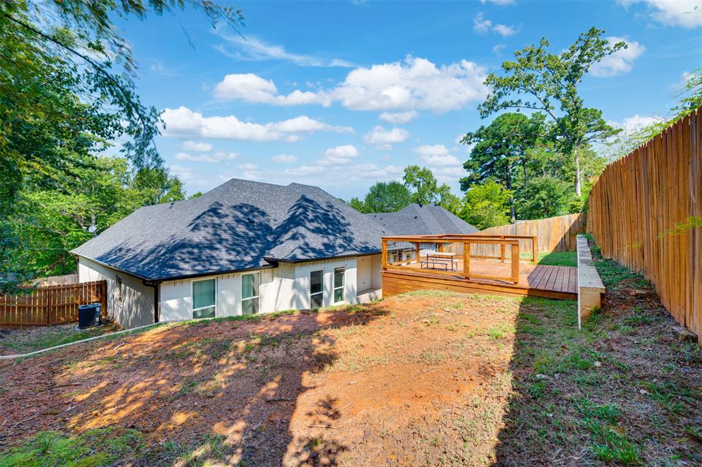 2830 Juniper Lane Tyler, TX 75701 - Photo 32 of 34 a view of a house with a yard and potted plants