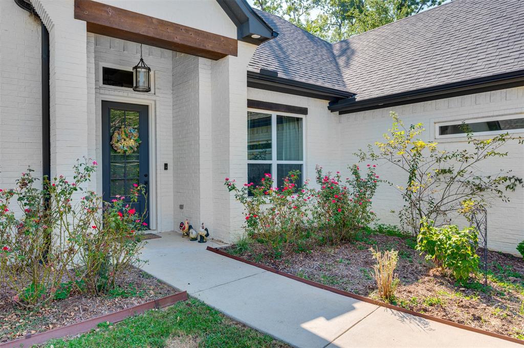 2830 Juniper Lane Tyler, TX 75701 - Photo 4 of 34 a front view of a house with a yard