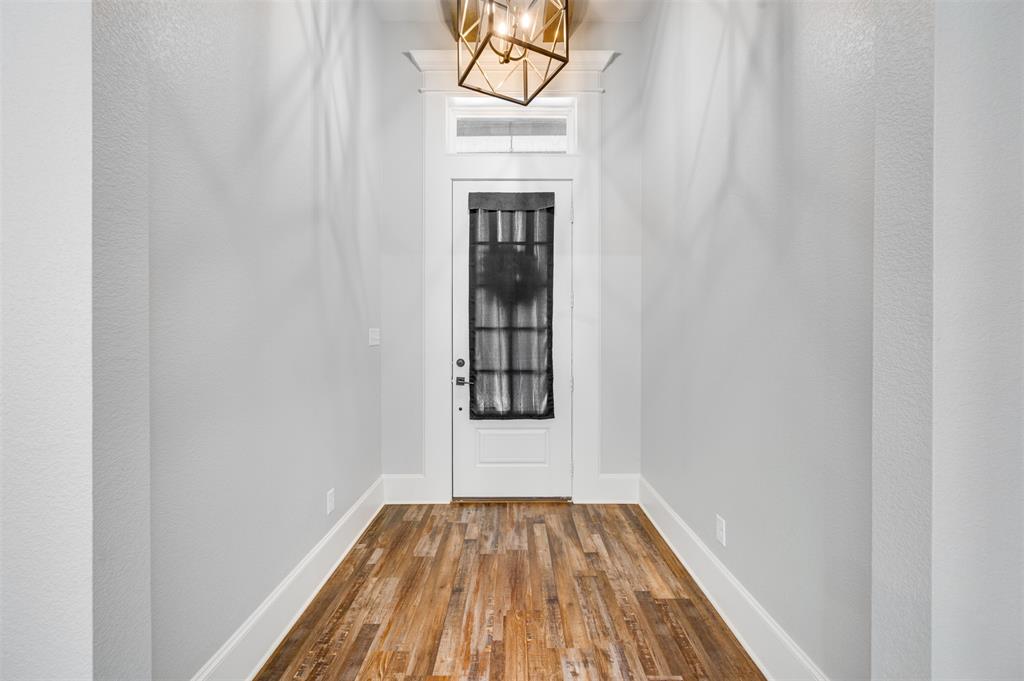 2830 Juniper Lane Tyler, TX 75701 - Photo 5 of 34 a view of an empty room with wooden floor and a window