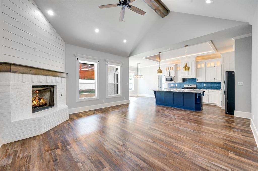 2830 Juniper Lane Tyler, TX 75701 - Photo 6 of 34 a view of a kitchen with a sink and a fireplace