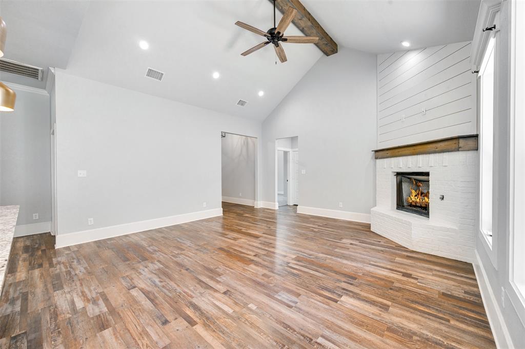 2830 Juniper Lane Tyler, TX 75701 - Photo 7 of 34 a view of empty room with wooden floor and fireplace