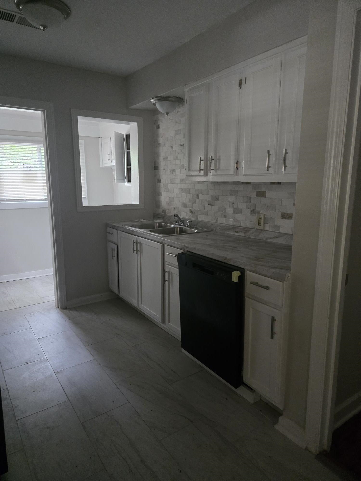 Bar with dishwasher and decorative backsplash