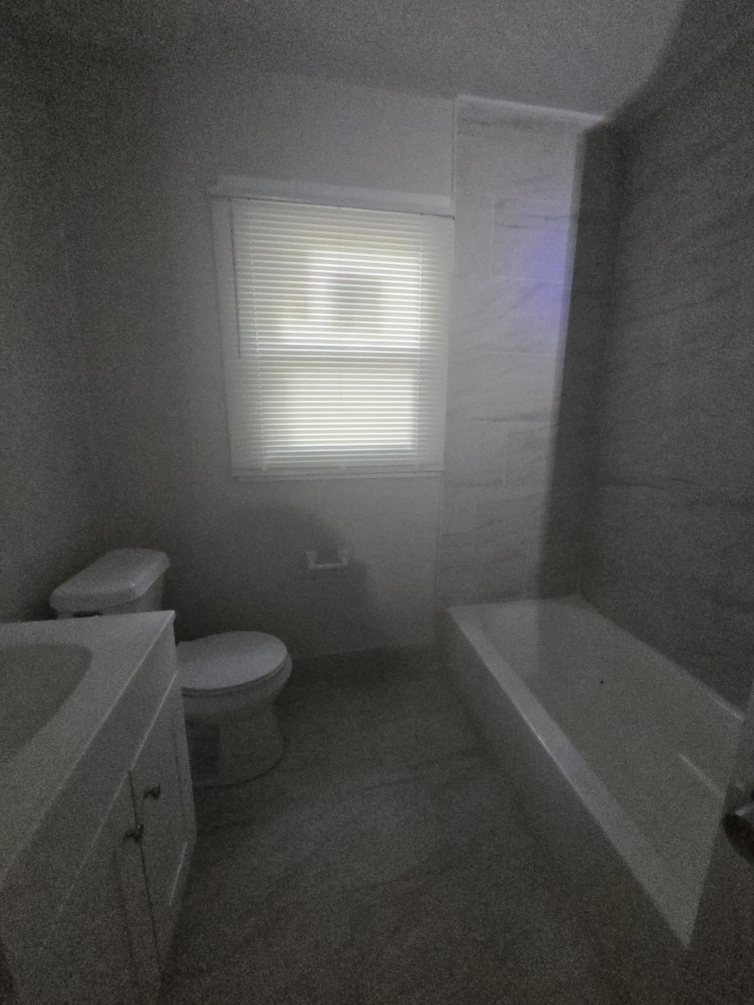 Full bath with vanity and a bath
