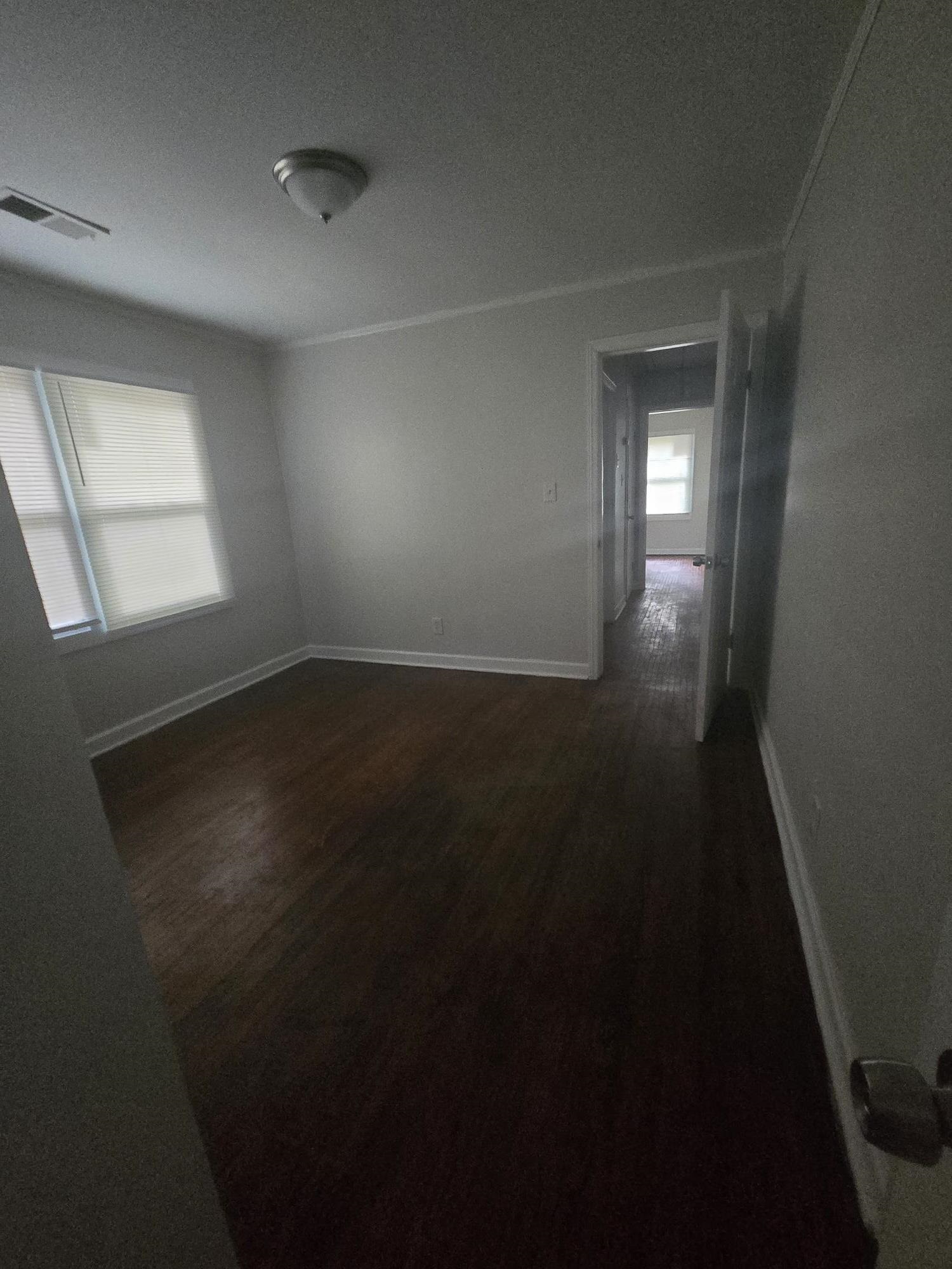 3551 Millington Road Memphis, TN 38127 - Photo 8 of 12 Spare room featuring wood finished floors and baseboards
