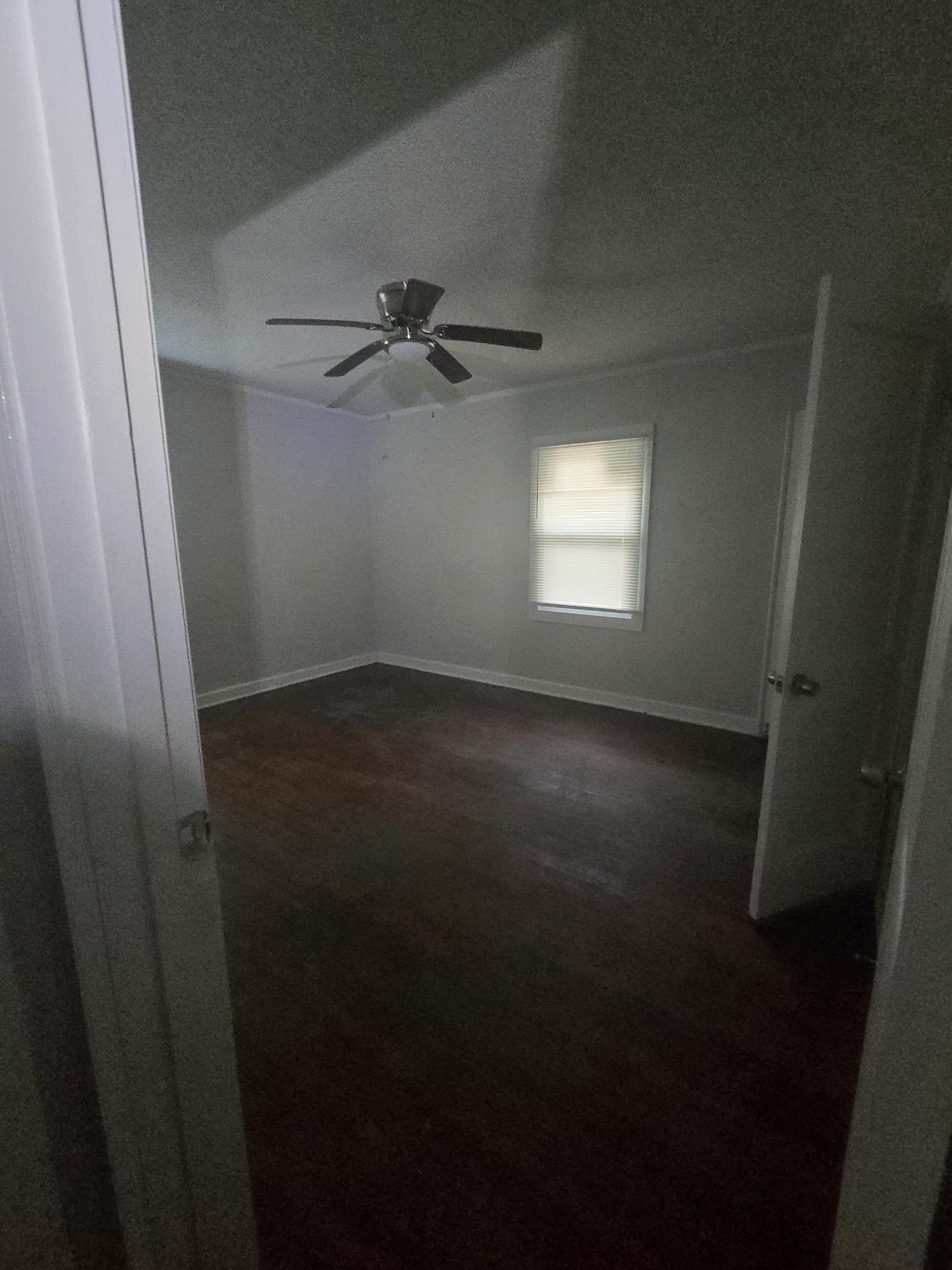 3551 Millington Road Memphis, TN 38127 - Photo 10 of 12 Empty room featuring ceiling fan and dark wood-type flooring