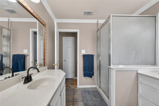 a bathroom with a sink and mirror