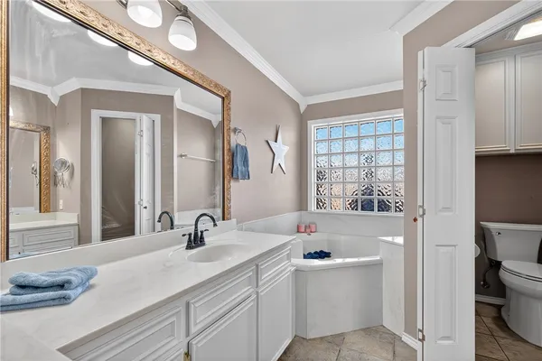 a bathroom with a sink a toilet and a bathtub