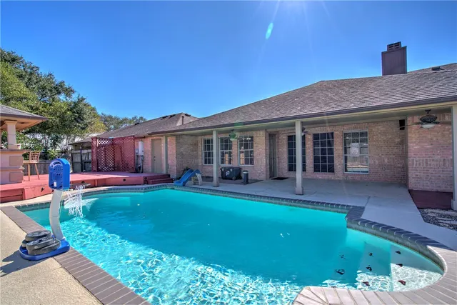 a house view with a seating space and garden