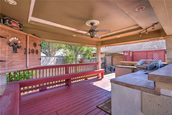 a view of a porch with wooden floor