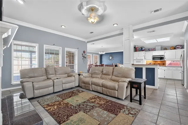 a living room with furniture and a table