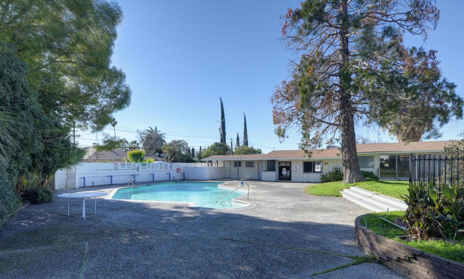 3440 Fulton Avenue, Unit 33 Sacramento, CA 95821 - Photo 11 of 19 a view of a house with a yard and furniture