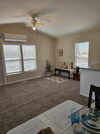 a living room with furniture and window