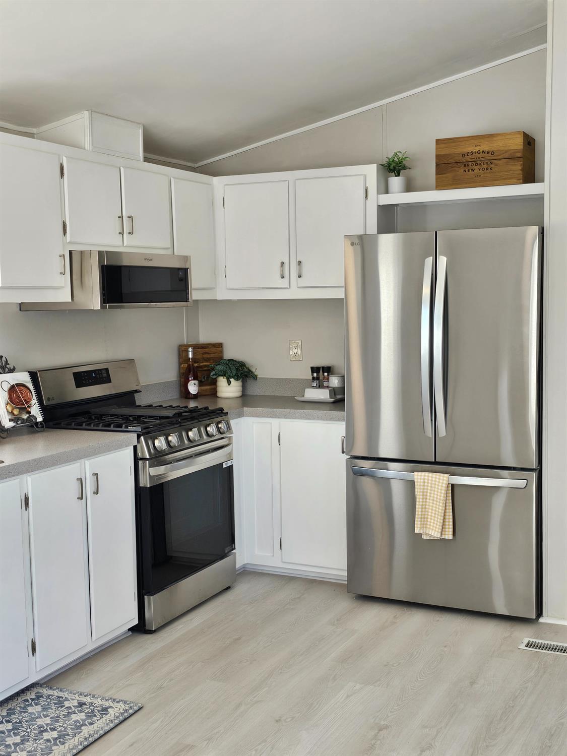 3440 Fulton Avenue, Unit 33 Sacramento, CA 95821 - Photo 16 of 19 a kitchen with stainless steel appliances granite countertop a refrigerator a stove a sink and white cabinets