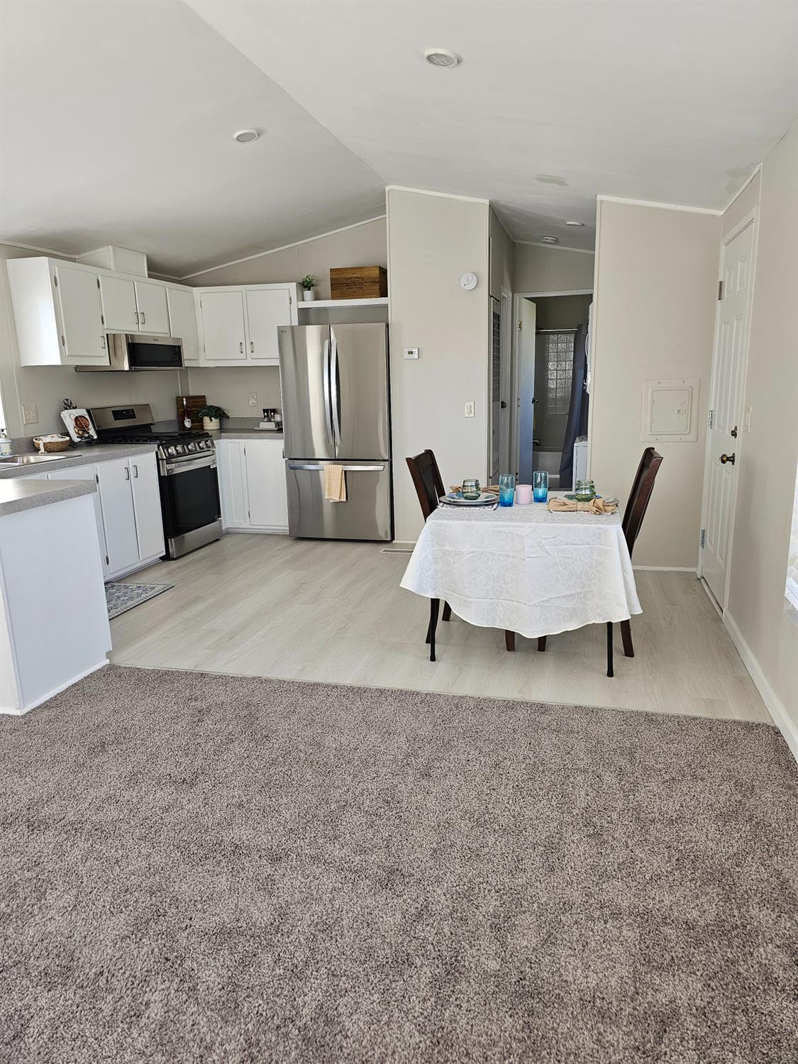3440 Fulton Avenue, Unit 33 Sacramento, CA 95821 - Photo 19 of 19 a living room with furniture and kitchen view