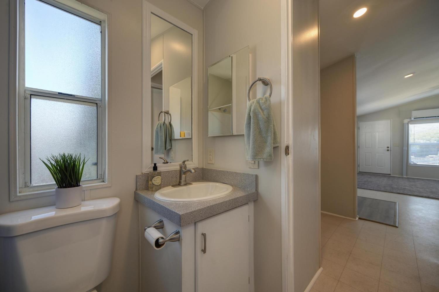 3440 Fulton Avenue, Unit 33 Sacramento, CA 95821 - Photo 3 of 19 a bathroom with a sink and a mirror