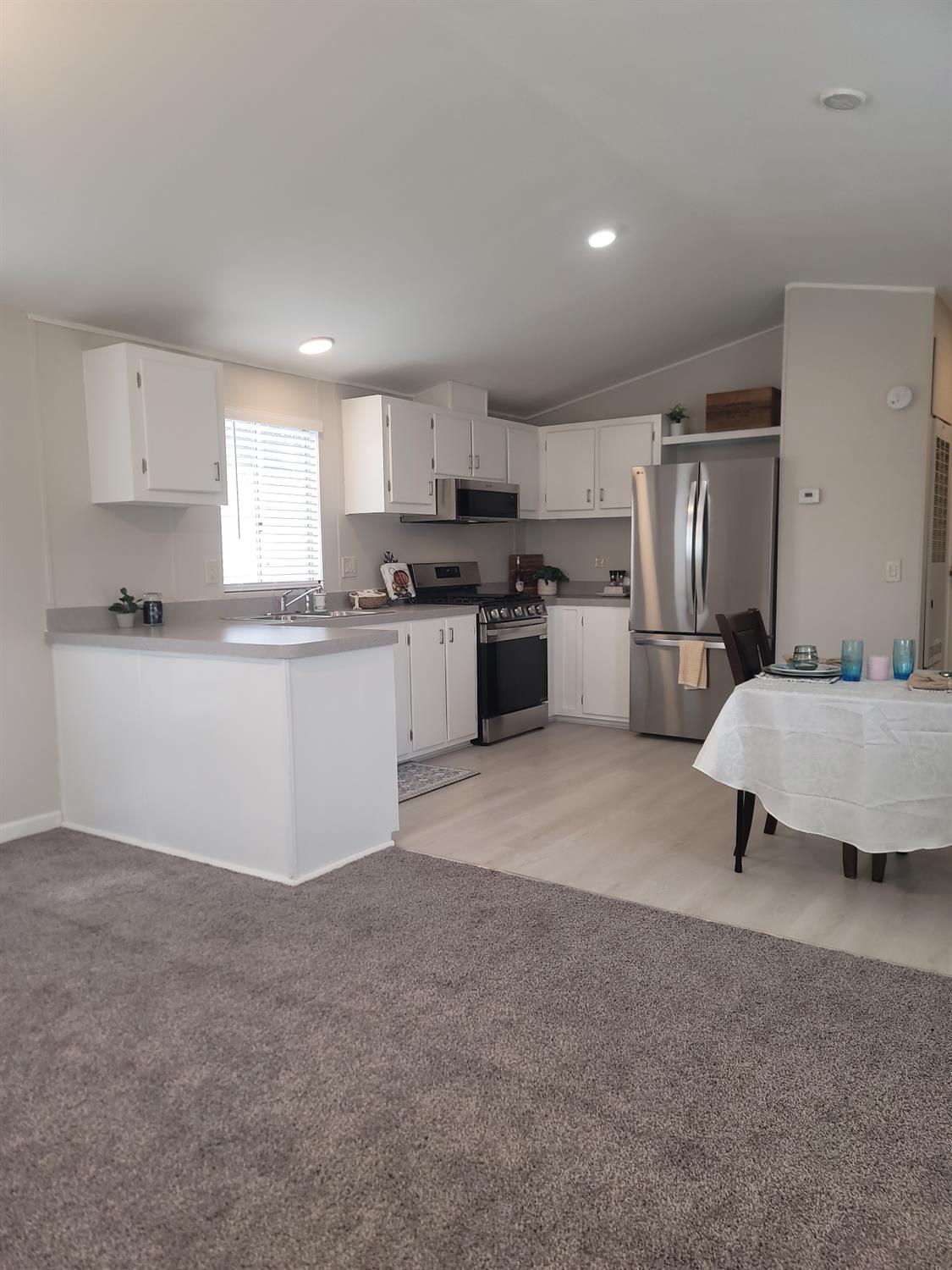 3440 Fulton Avenue, Unit 33 Sacramento, CA 95821 - Photo 5 of 19 a kitchen with stainless steel appliances granite countertop a refrigerator sink and stove
