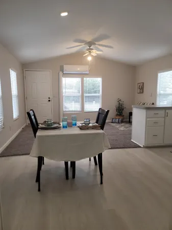 a view of a livingroom with furniture and window