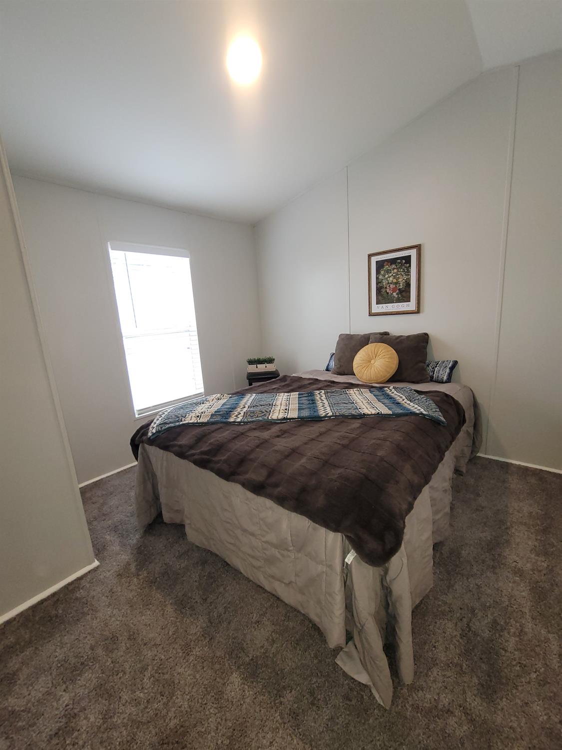 3440 Fulton Avenue, Unit 33 Sacramento, CA 95821 - Photo 10 of 19 a bedroom with a bed and window