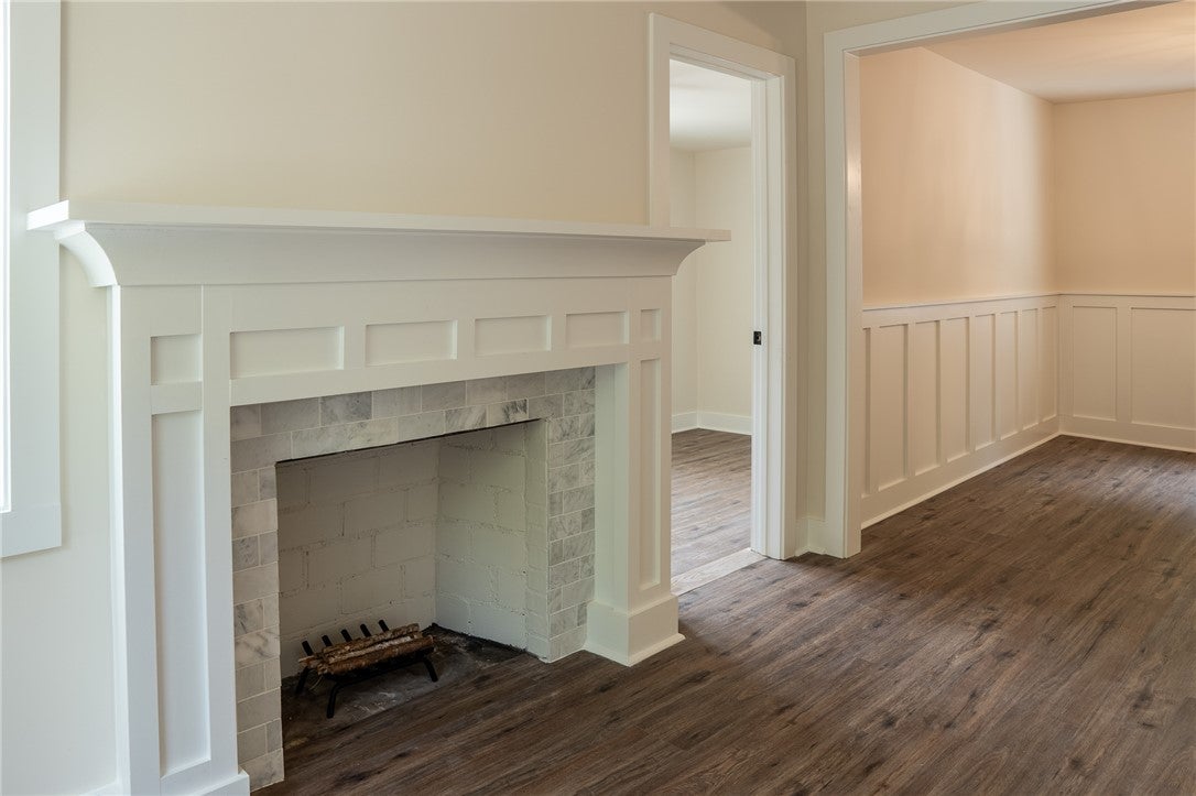 1312 Rocky Brook Road Opelika, AL 36801 - Photo 9 of 45 This inviting interior boasts a beautifully crafted fireplace and durable flooring, perfect for comfortable living.