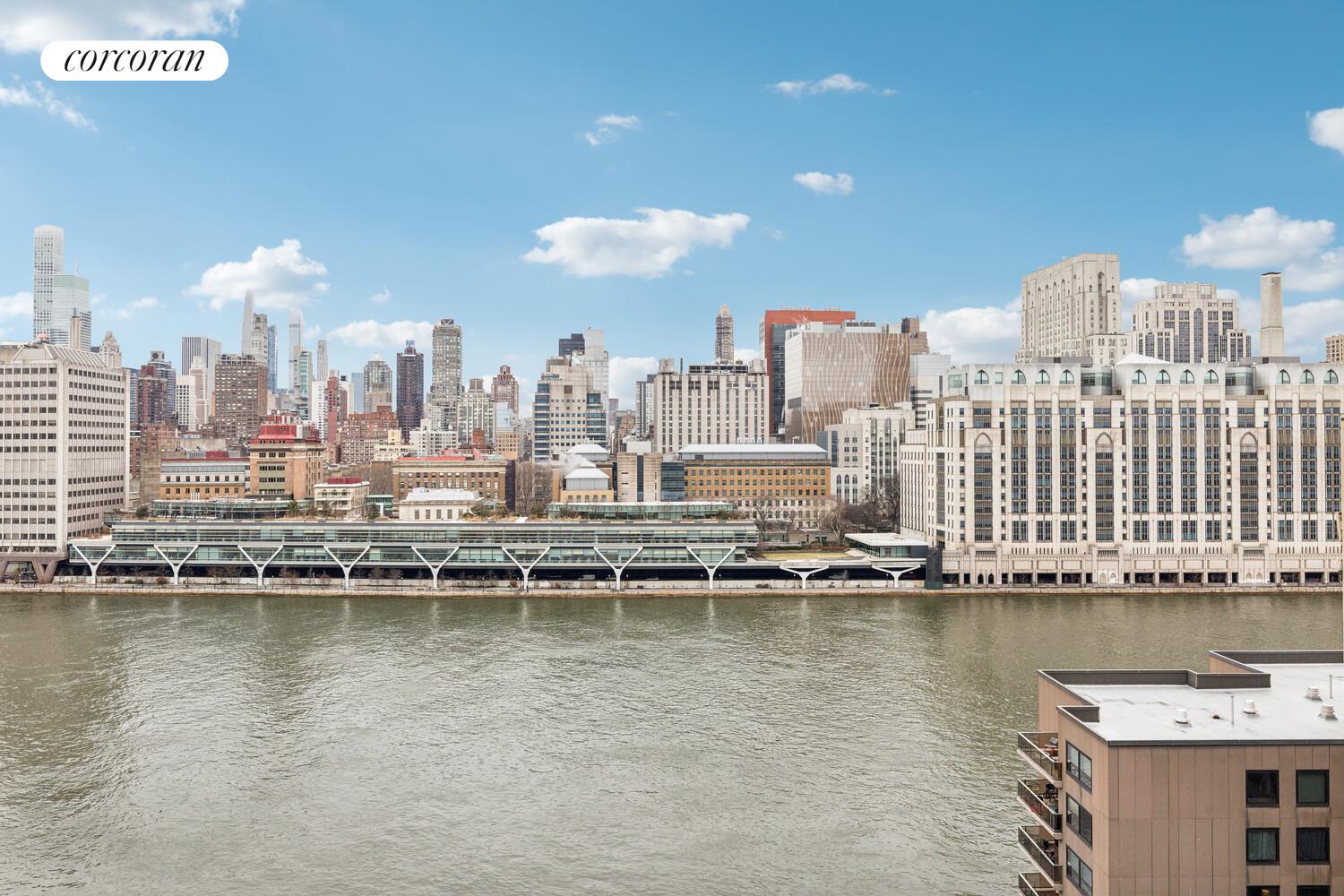 531 Main Street, Unit 1502 Manhattan, NY 10044 - Photo 4 of 11 a view of a city with tall buildings