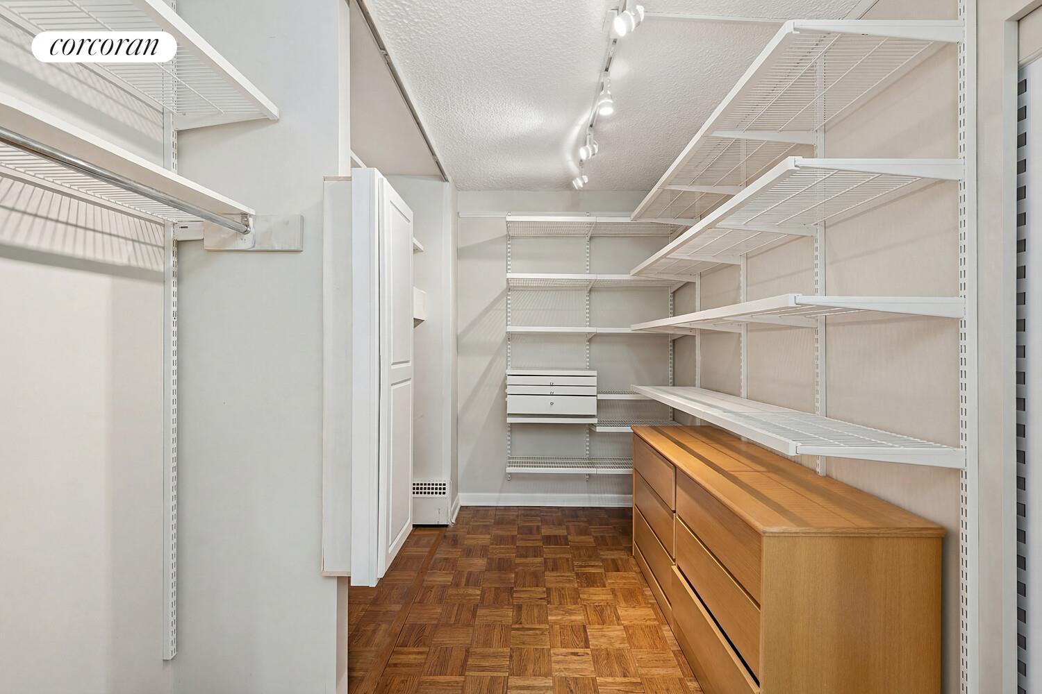 531 Main Street, Unit 1502 Manhattan, NY 10044 - Photo 7 of 11 a view of walk in closet with empty racks