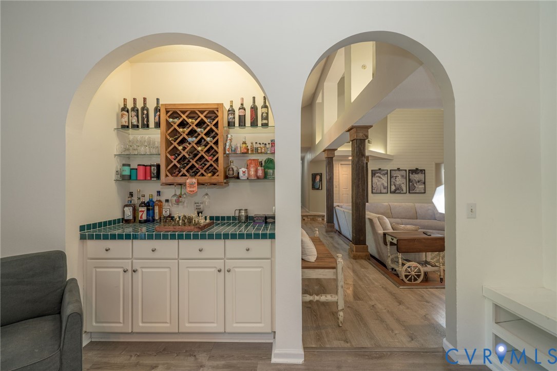 12700 Coalboro Road Chesterfield, VA 23838 - Photo 21 of 50 Arched entryway revealing a built-in wet bar with