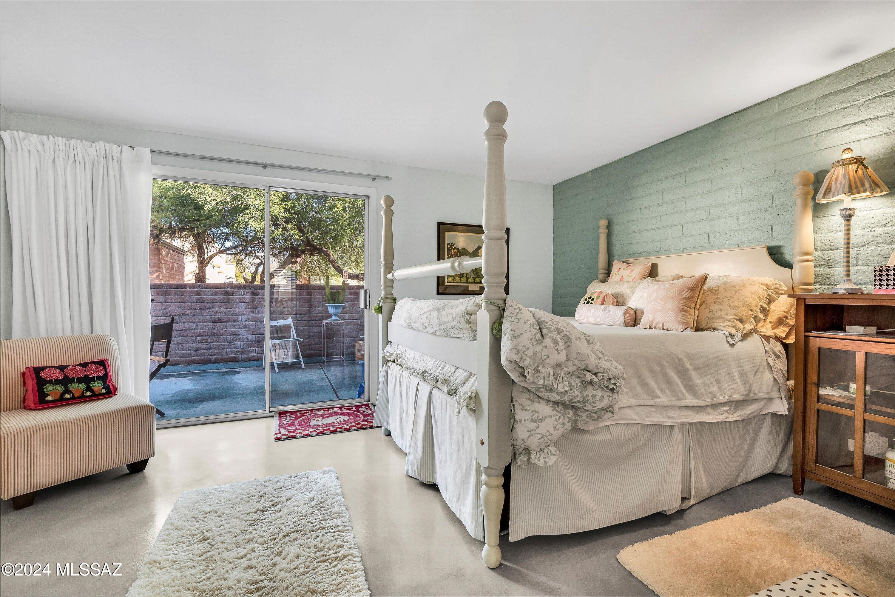 4309 East Presidio Road Tucson, AZ 85712 - Photo 17 of 28 a bed room with a bed and a view of bedroom