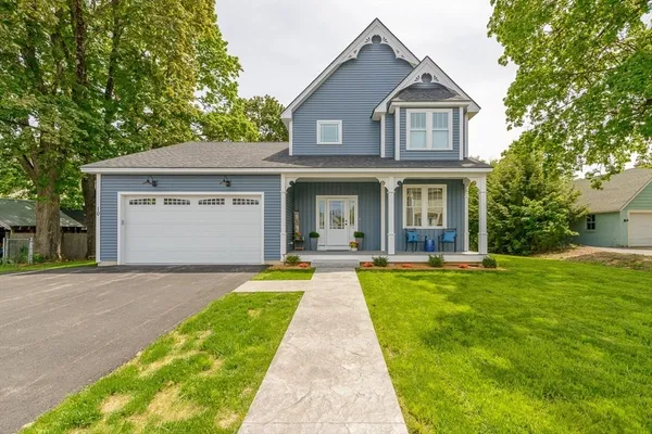 a front view of a house with yard