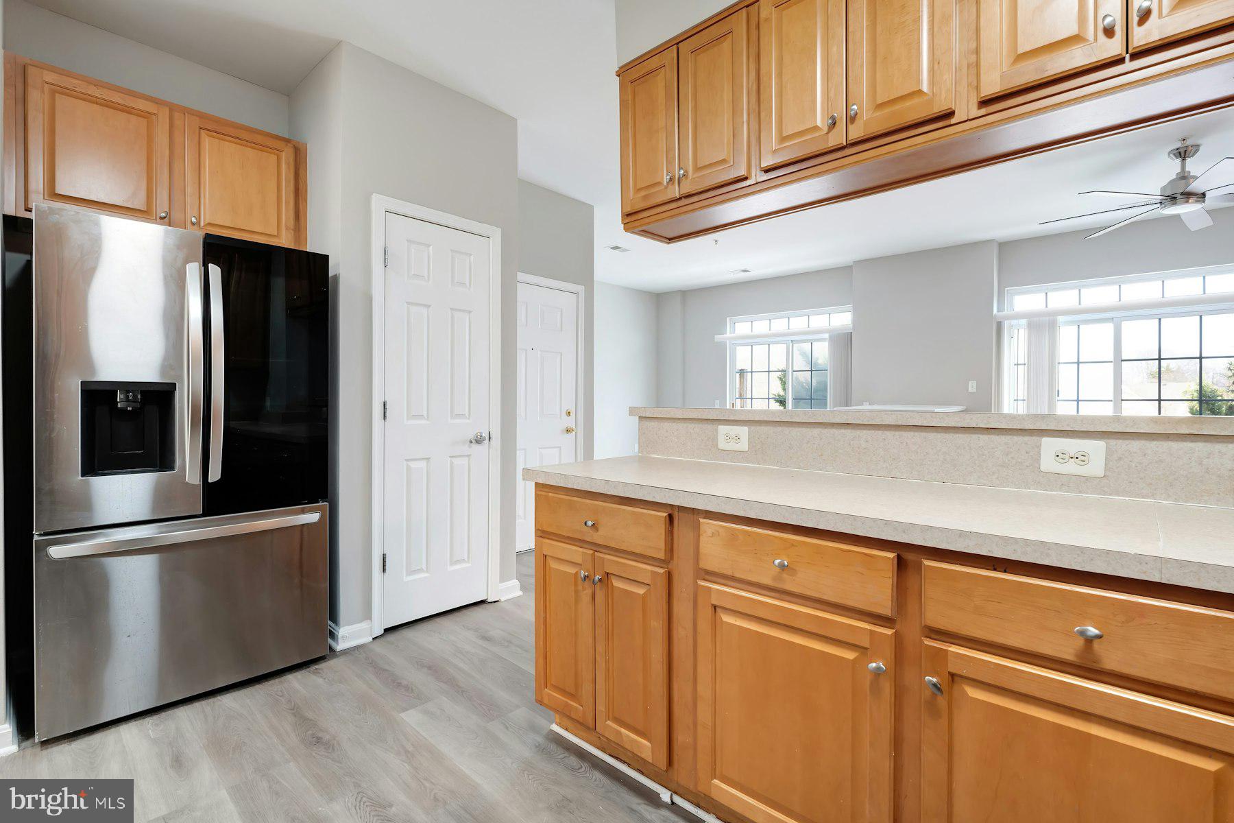 1838 Cedar Cove Way, Unit 201 Woodbridge, VA 22191 - Photo 14 of 38 a kitchen with stainless steel appliances granite countertop a refrigerator and a sink