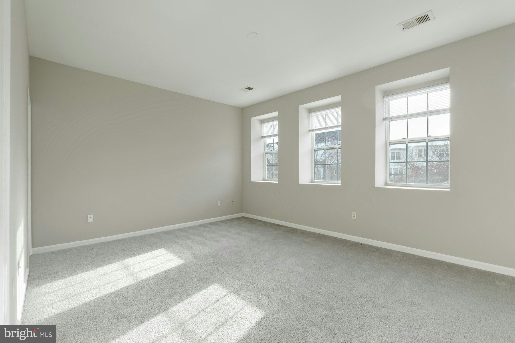 1838 Cedar Cove Way, Unit 201 Woodbridge, VA 22191 - Photo 16 of 38 an empty room with windows