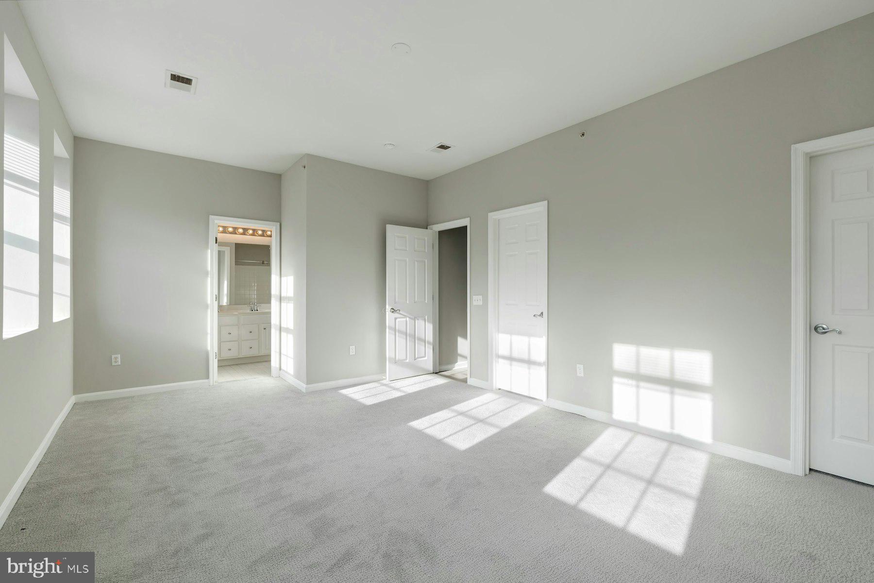 1838 Cedar Cove Way, Unit 201 Woodbridge, VA 22191 - Photo 17 of 38 a view of an empty room with a window