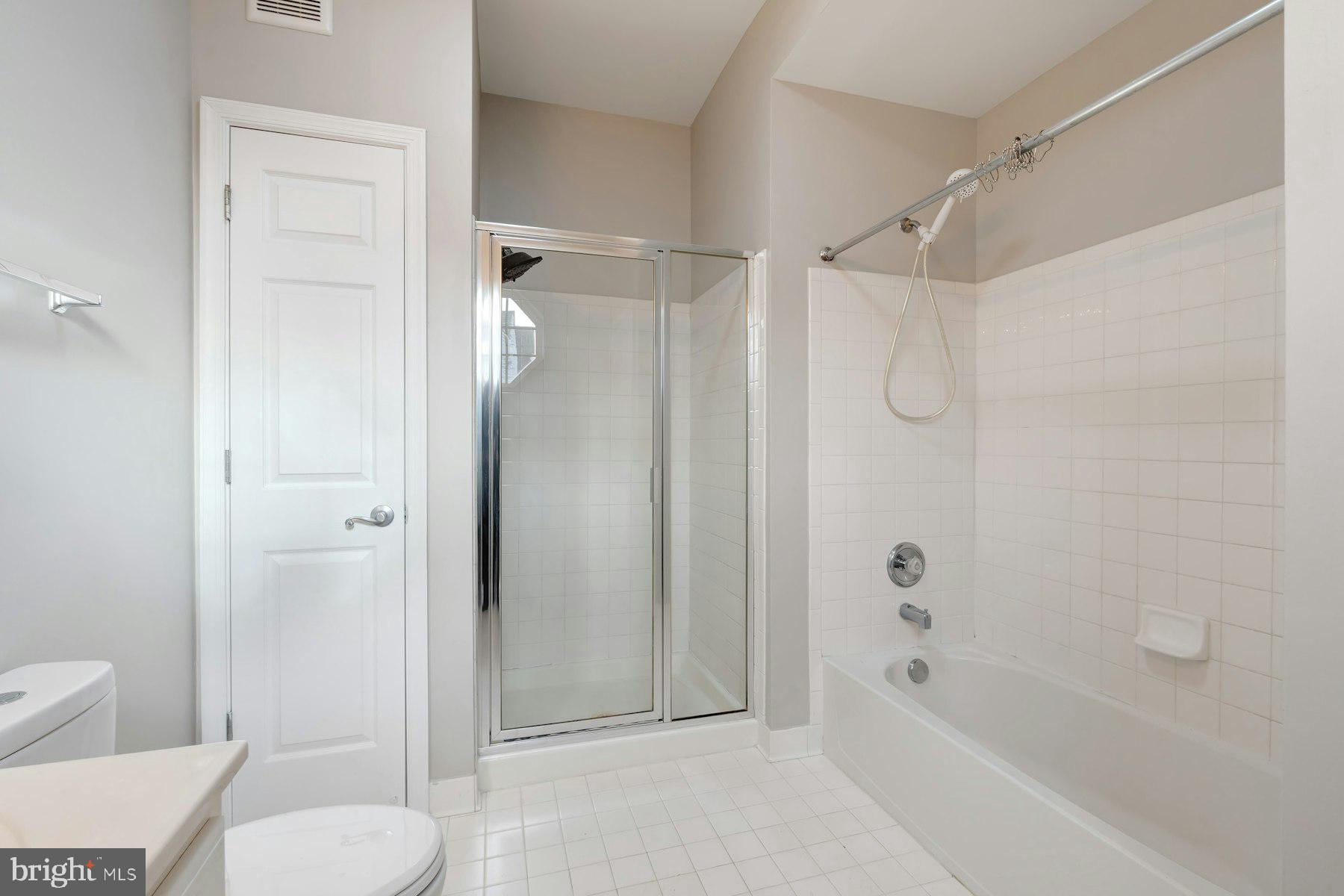 1838 Cedar Cove Way, Unit 201 Woodbridge, VA 22191 - Photo 19 of 38 a bathroom with a shower and a toilet