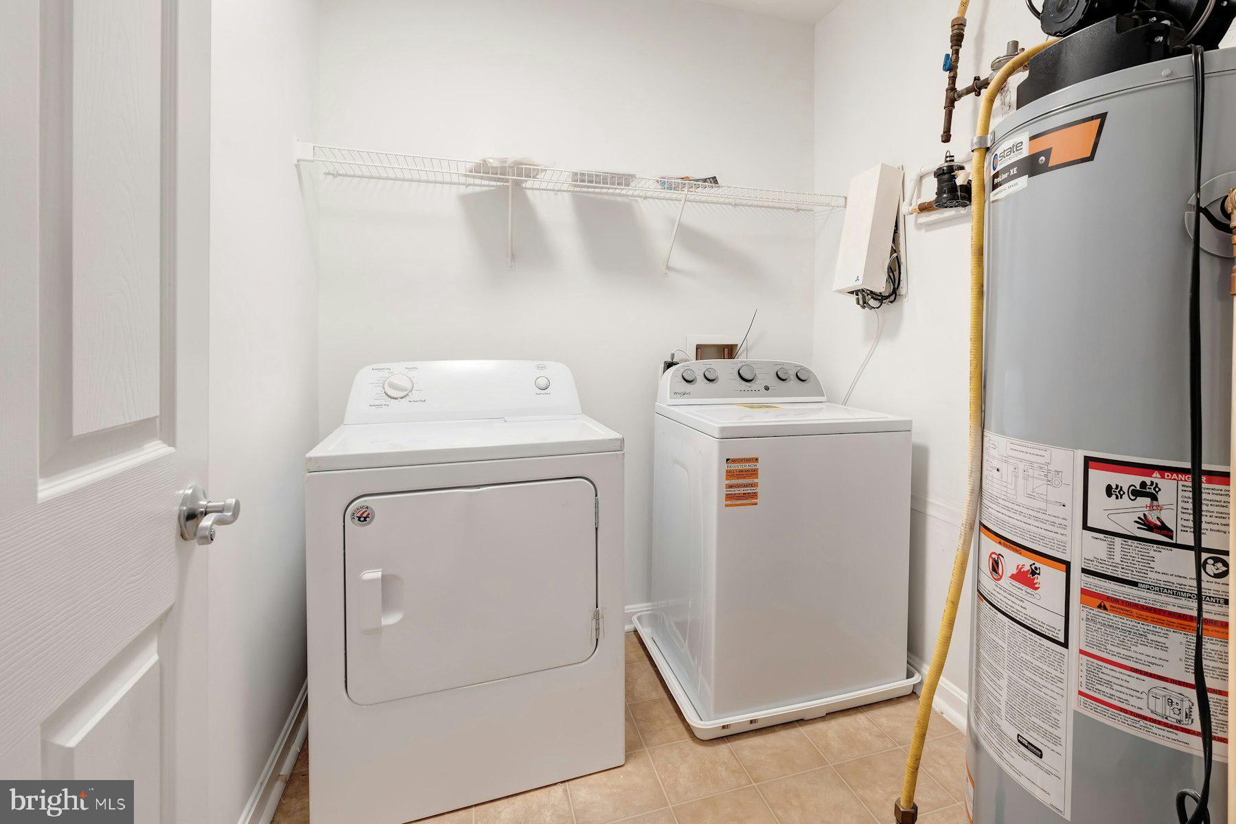 1838 Cedar Cove Way, Unit 201 Woodbridge, VA 22191 - Photo 25 of 38 a utility room with dryer and washer