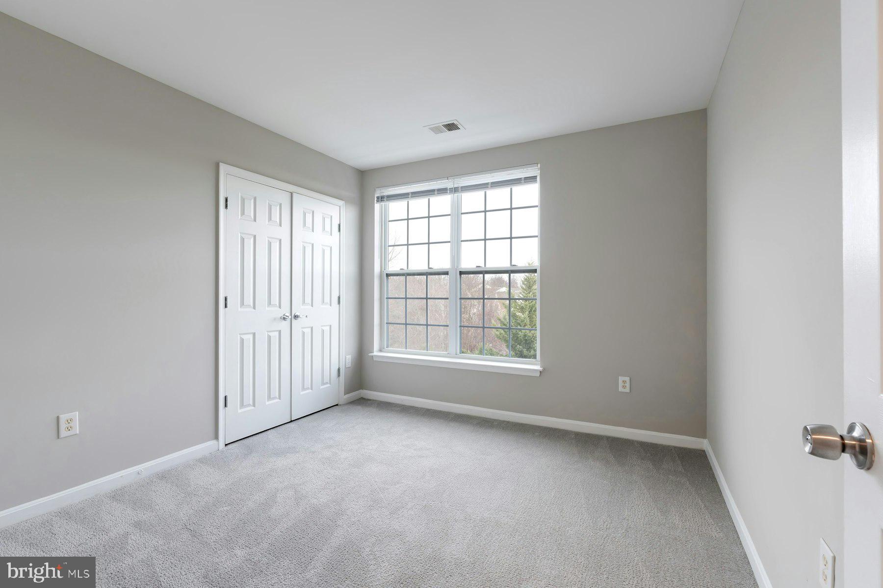 1838 Cedar Cove Way, Unit 201 Woodbridge, VA 22191 - Photo 30 of 38 a view of an empty room with a window