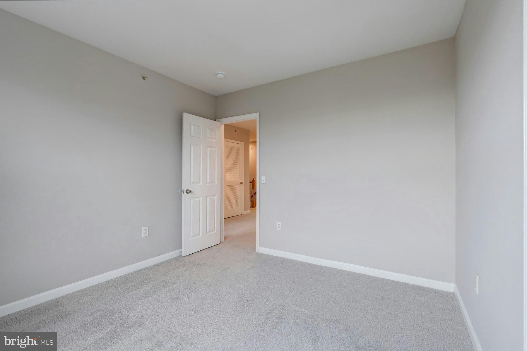 1838 Cedar Cove Way, Unit 201 Woodbridge, VA 22191 - Photo 31 of 38 a view of an empty room