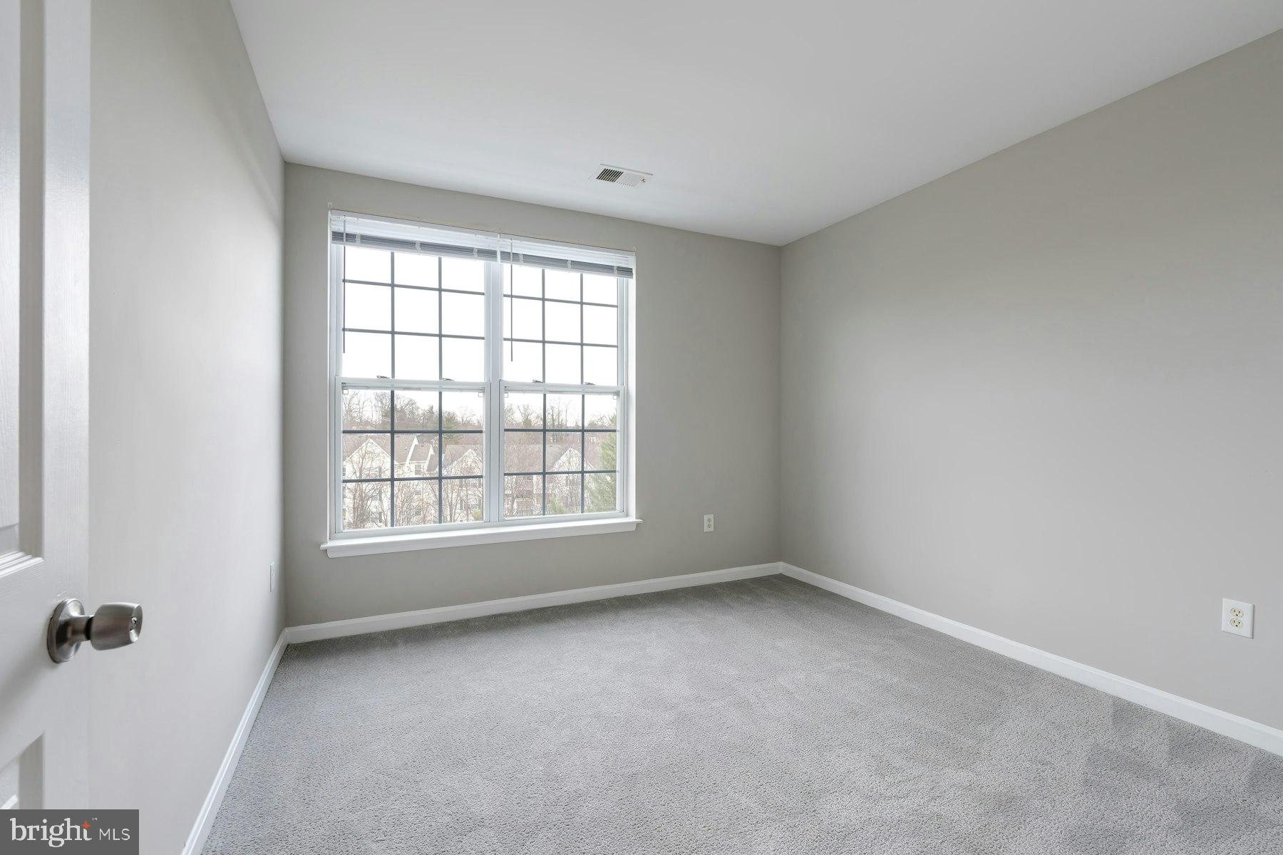 1838 Cedar Cove Way, Unit 201 Woodbridge, VA 22191 - Photo 32 of 38 an empty room with a window