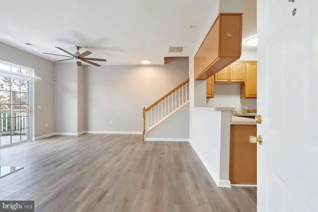 a view of an entryway with wooden floor