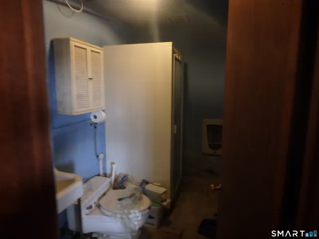 a bathroom with a sink mirror and vanity