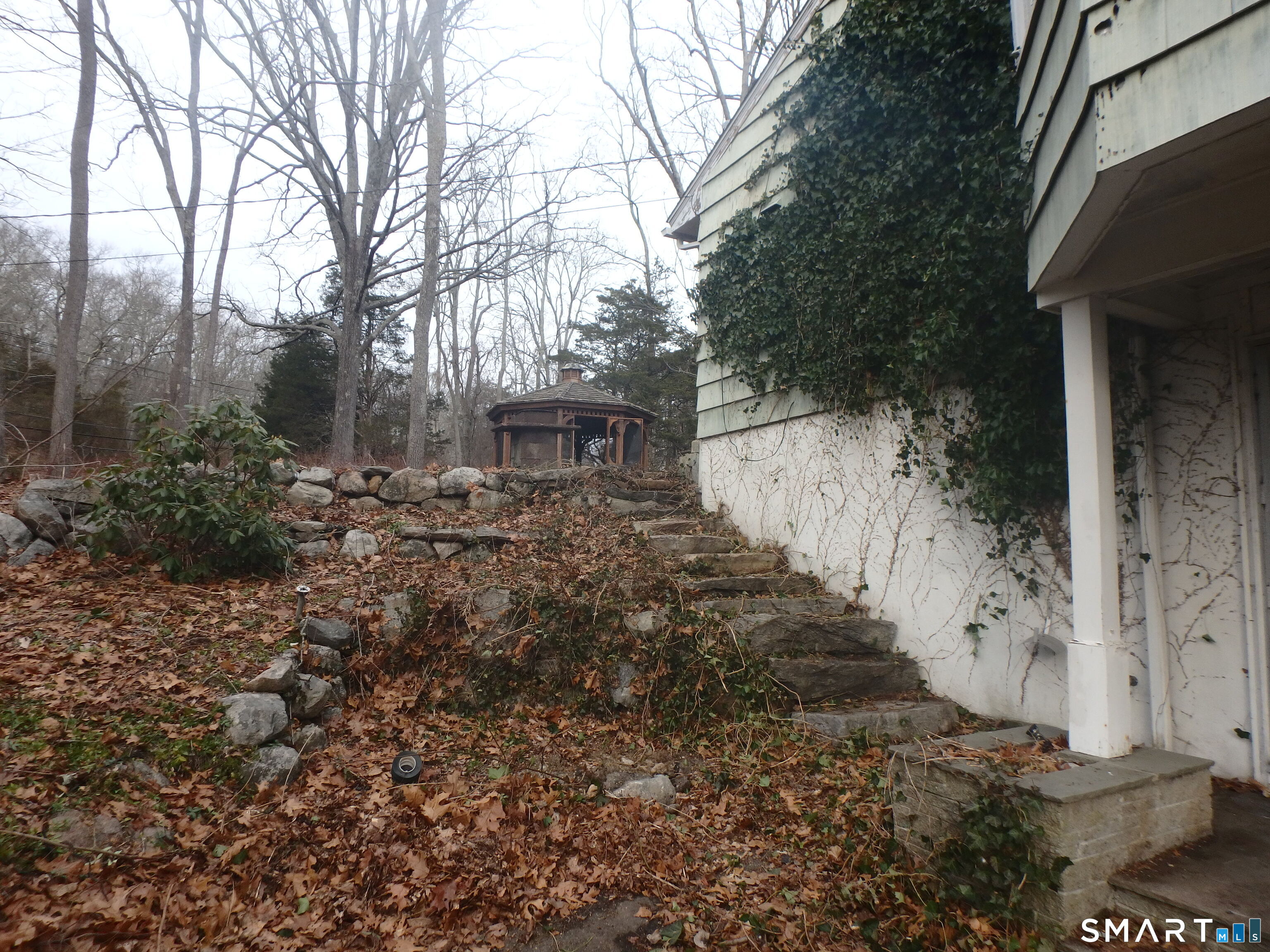 1918 Highway 12 Ledyard, CT 06335 - Photo 19 of 34 a view of house with trees in the background
