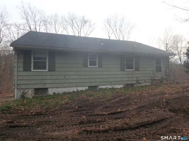 a view of house with trees in the background