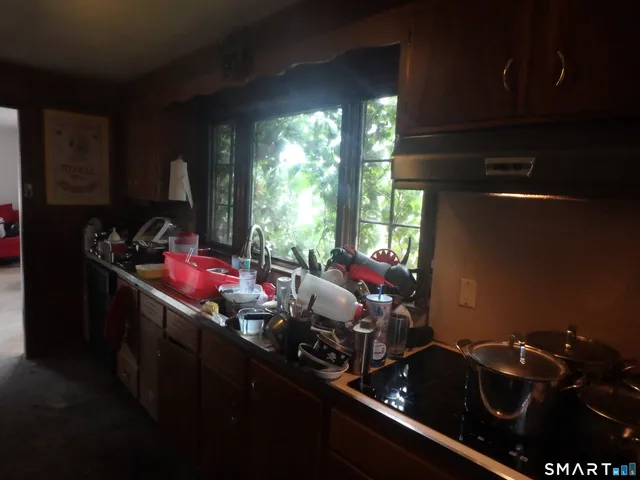 a room with furniture closet and window