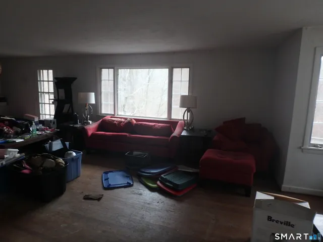 a room with furniture toys and a window