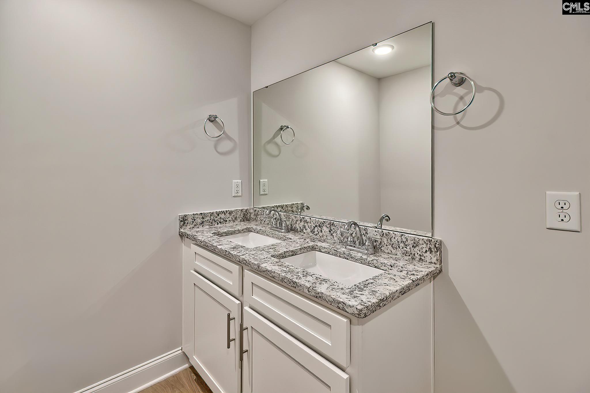 259 Eastover Road Eastover, SC 29044 - Photo 8 of 16 a bathroom with a sink and a mirror