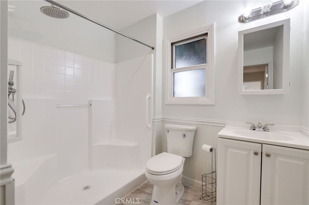 10485 Parakeet Circle Fountain Valley, CA 92708 - Photo 11 of 11 a bathroom with a sink toilet and shower