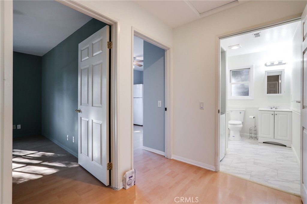 10485 Parakeet Circle Fountain Valley, CA 92708 - Photo 4 of 11 a view of a room with wooden floor and a bathroom