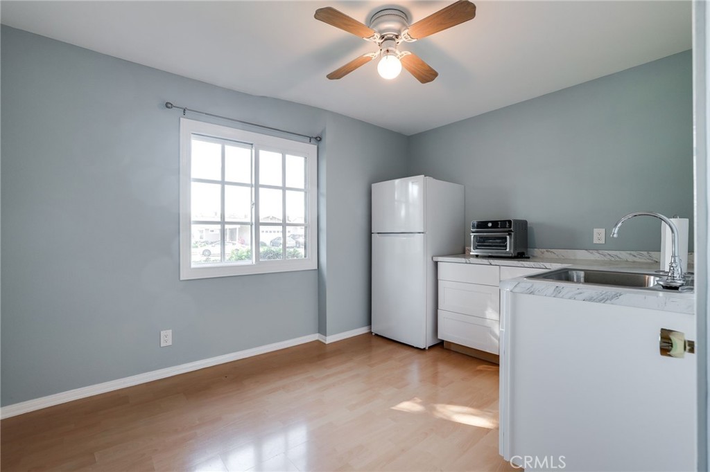 10485 Parakeet Circle Fountain Valley, CA 92708 - Photo 8 of 11 a view of storage and utility room with washer and dryer