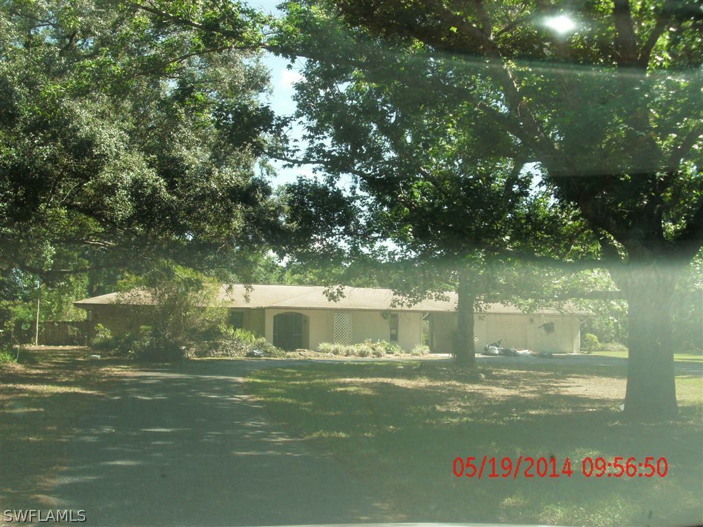 13851 River Road Fort Myers, FL 33905 - Photo 1 of 12 a view of a lake from a yard