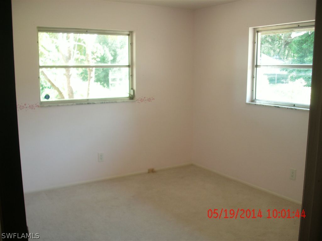 13851 River Road Fort Myers, FL 33905 - Photo 8 of 12 an empty room with a window