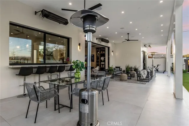 a view of a swimming pool with a garden and trees