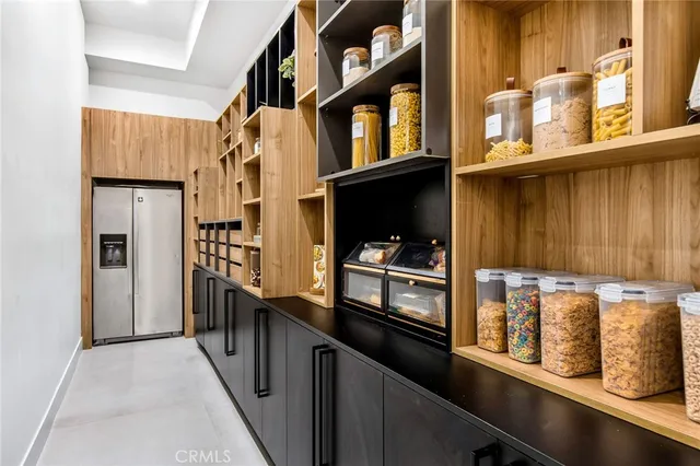 a view of a big house with a big yard and large trees